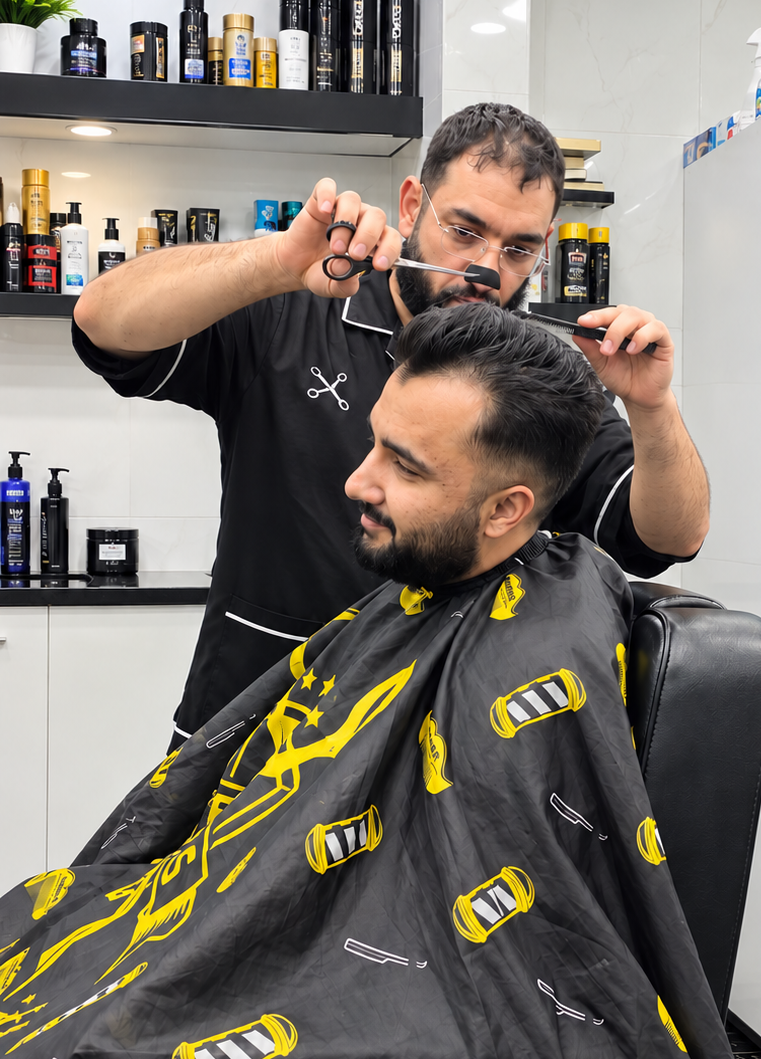 Scissor King barber wearing glasses carefully cutting a client's hair in Punchbowl